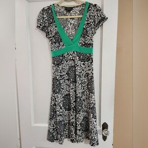 Elegant Black and White Dress with Green Accents